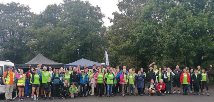 A large group of walkers prepare to set off on their fundraising walk