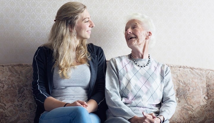 young woman and older woman talking