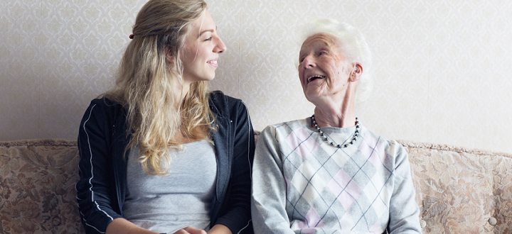 young woman and older woman talking