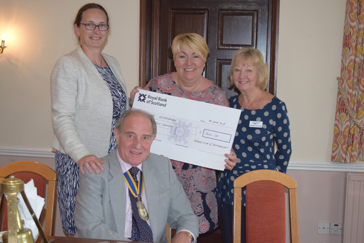Rotherham Rotary Club present a cheque to Age UK Rotherham Chief Executive Lesley Dabell