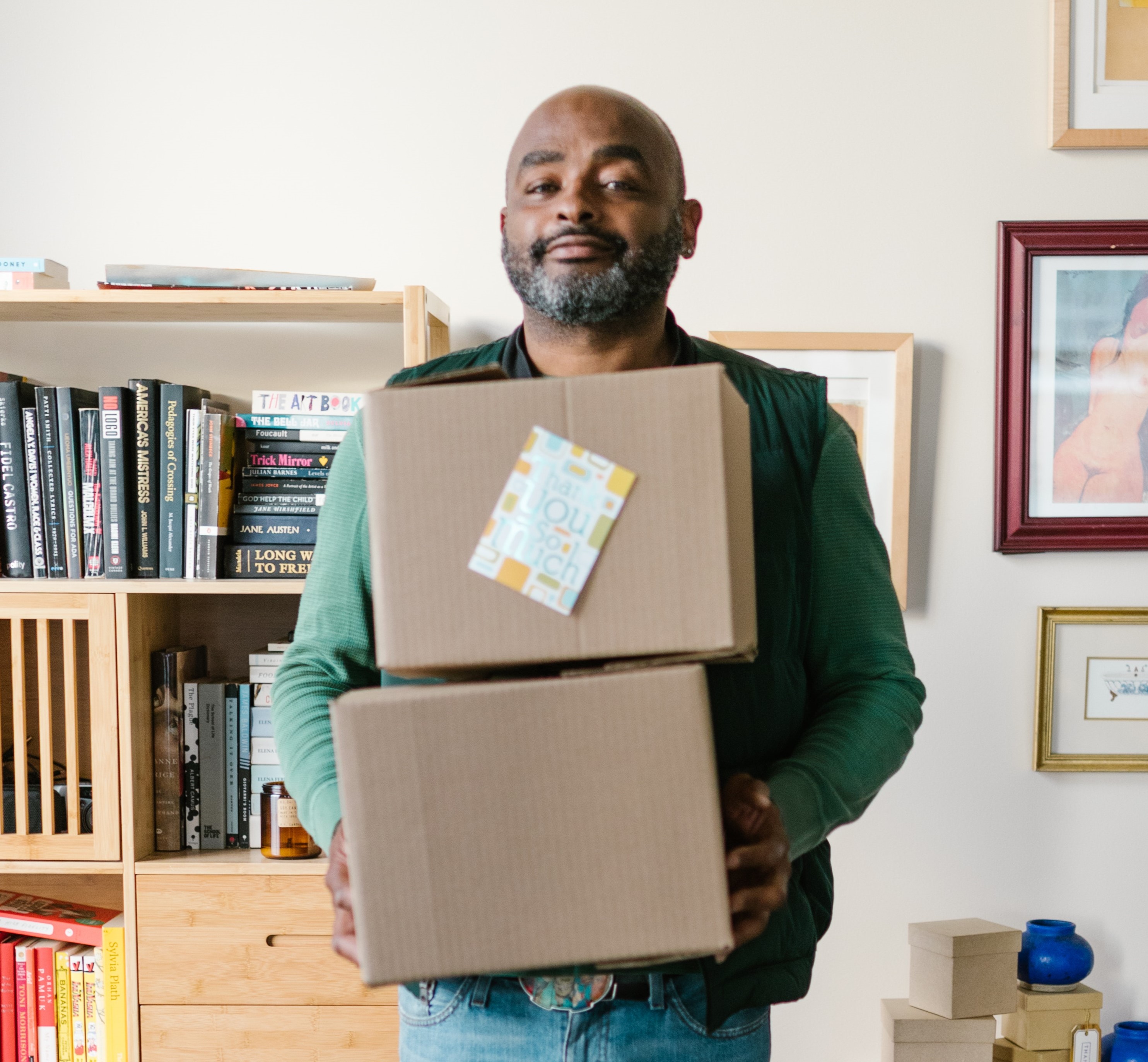 black man holding boxes.jpg