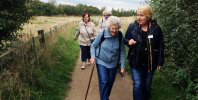 Group of older ladies walking in countryside