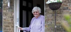 old woman opening front door