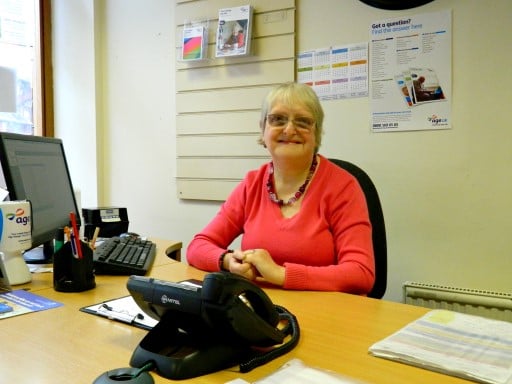 Volunteer sat at a desk