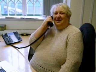 EngAge Rotherham Volunteer Kathy on phone EngAge Rotherham volunteer Kathy on phone
