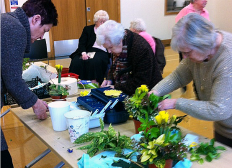 Thorpe Hesley Group members making flower arrangements