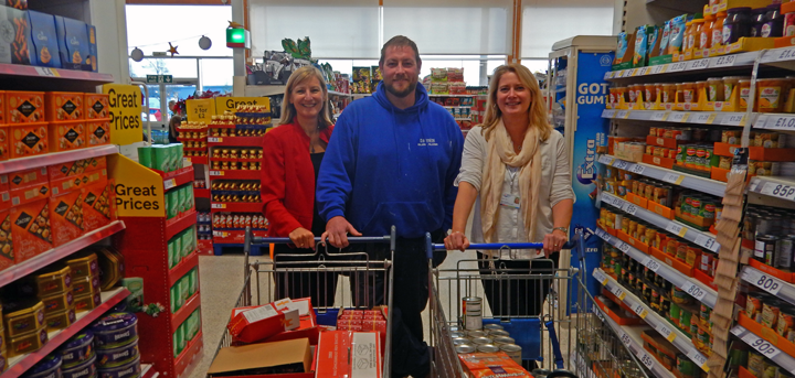 Age UK Shropshire Telford & Wrekin staff with David Jenkins at the end of his trolley dash