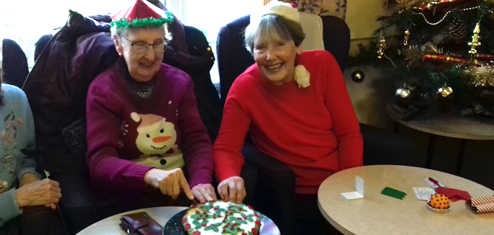 Cutting the dementia support group's Christmas cake