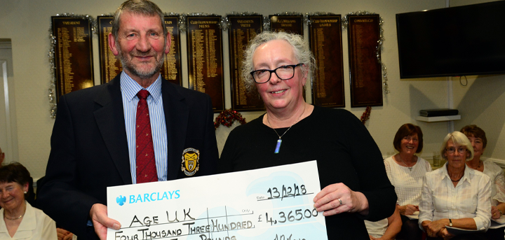 Les Lewis presenting a cheque to Heather Osborne