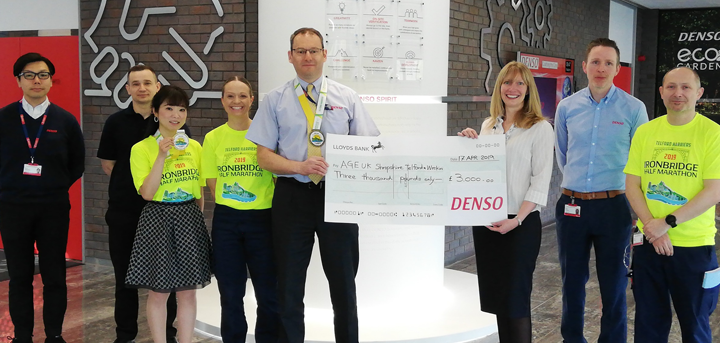Simon Cope and fellow DENSO staff present a cheque to Catherine McCloy of Age UK Shropshire Telford & Wrekin