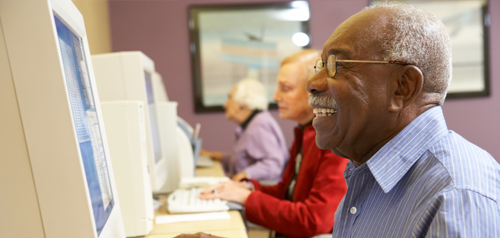 Older people at a computer class