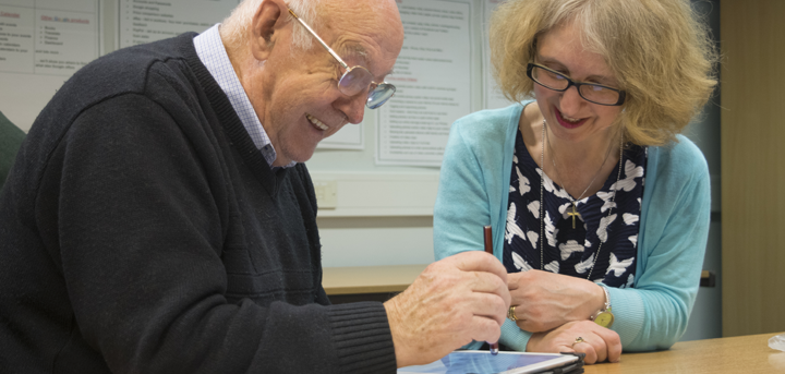 Older person using a tablet computer