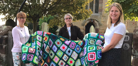 Margaret Stokes with Age UK Shropshire Telford & Wrekin staff and the donated blankets