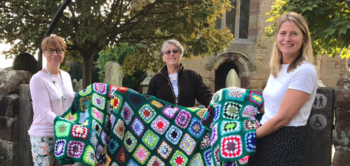 Margaret Stokes with Age UK Shropshire Telford & Wrekin staff and the donated blankets