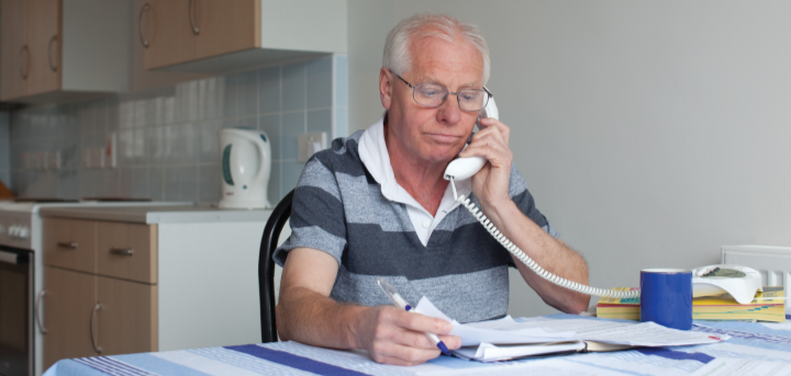 Older man looking at paperwork