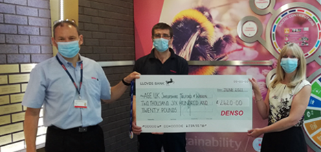 Denso staff presenting a cheque to our Head of Income Generation, Catherine McCloy 