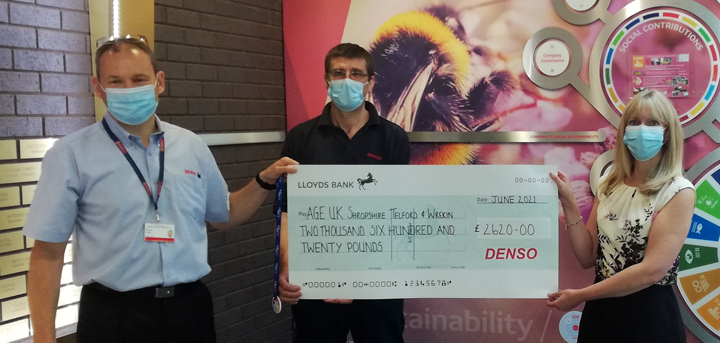 Denso staff presenting a cheque to our Head of Income Generation, Catherine McCloy 