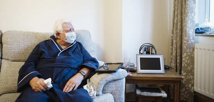 Older man sitting on a sofa