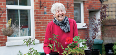 Older woman gardening outside