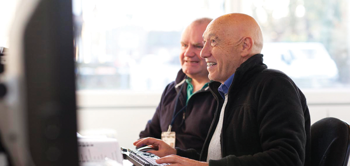 Older man learning computer skills