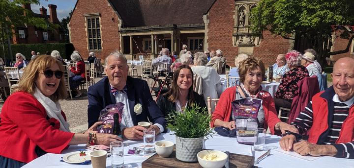 Older people with Shrewsbury School students at a Jubilee party