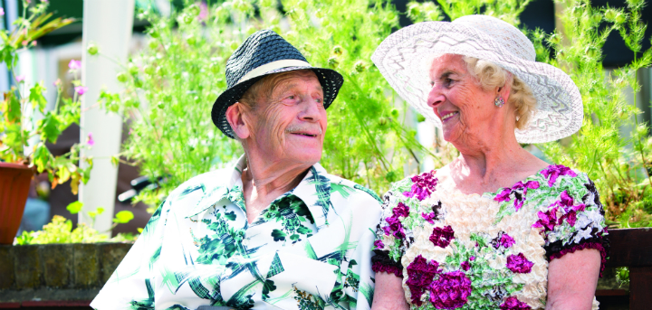 Older people sitting in summer garden