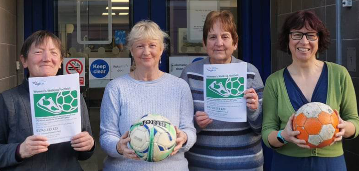Age UK Shropshire Telford & Wrekin staff and volunteers with footballs