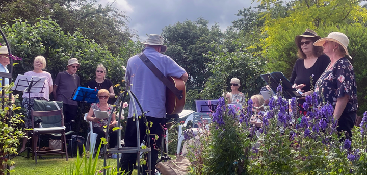 The Acorn Singers performing in Frank Davies' garden
