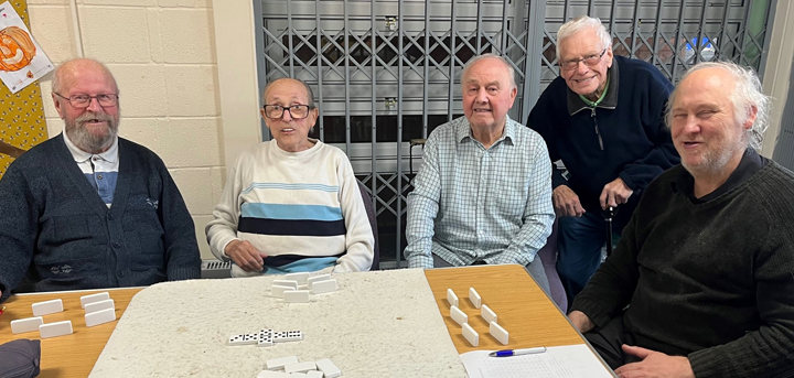 Older men playing dominoes at Age UK Shropshire Telford & Wrekin’s Woodside day centre