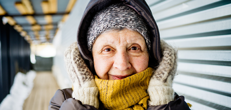 An older woman wearing winter clothing