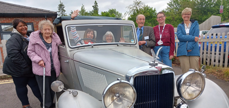 Pontesbury dementia support group admiring a vintage car