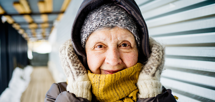 An older woman wearing winter clothing
