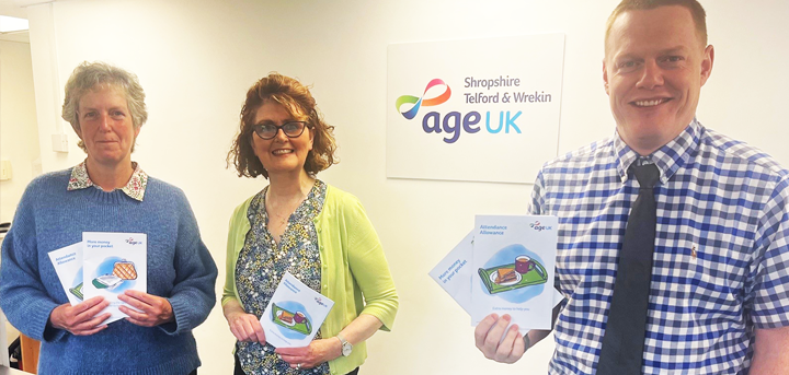Age UK Shropshire Telford & Wrekin’s Benefits team holding information guides