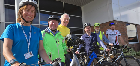 Group of cyclists outside a building