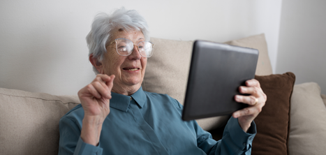 Older woman looking at a tablet