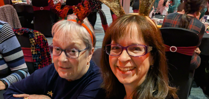 Two volunteers at the Christmas lunch event