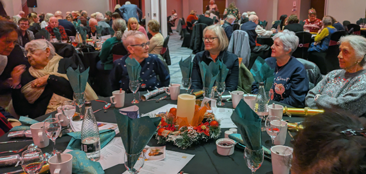 Volunteers round a table
