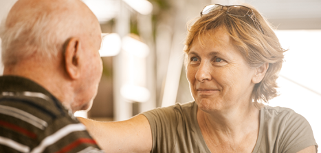 Older man and woman talking