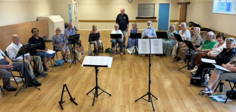 The Acorn Singers with their newly donated music stands