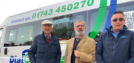 Three men standing by a Shrewsbury Dial-a-Ride bus