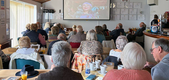 The audience watching Singin' in the Rain