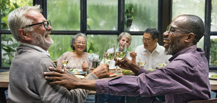 Older people socialising at a meal