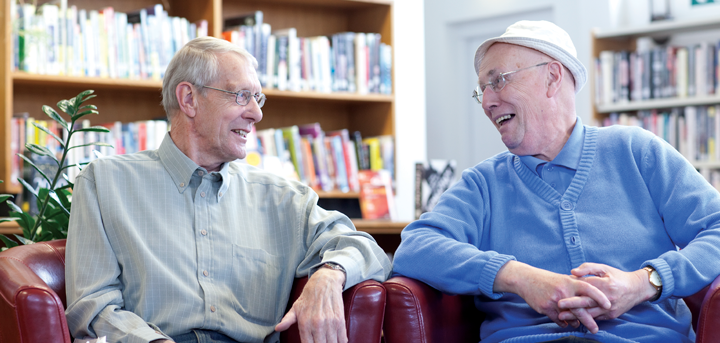 Two men socialising at a reading group