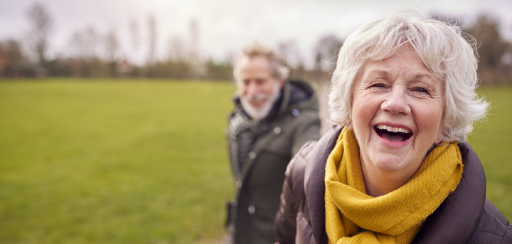 Older woman and man walking outside