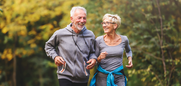 Older couple running outside