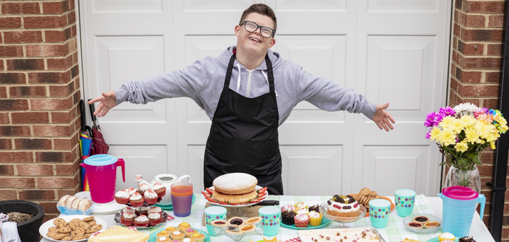 Young person with cakes for sale