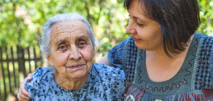 Woman hugging an older woman