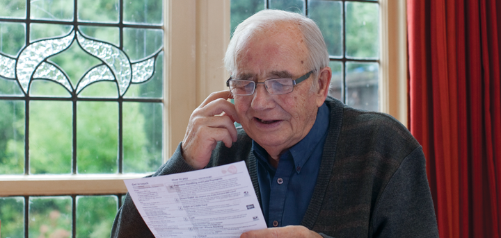 An man reading paperwork
