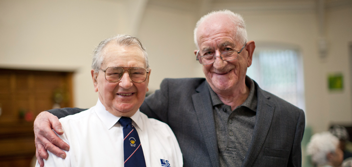 An older man with dementia and his carer
