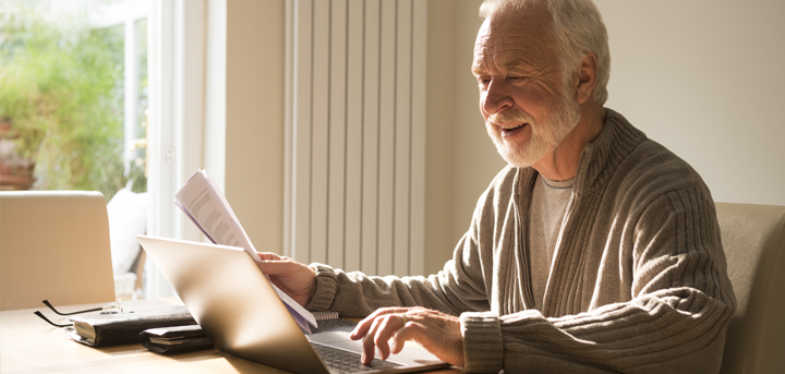 Older man using a laptop